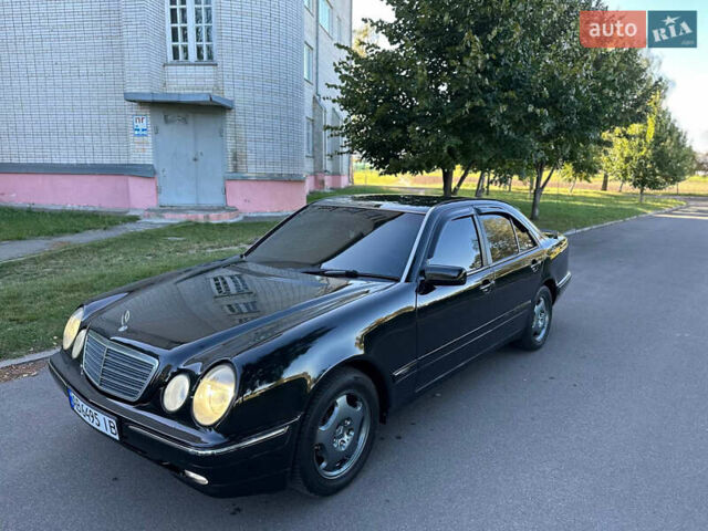 Черный Мерседес Е-Класс, объемом двигателя 2 л и пробегом 390 тыс. км за 2999 $, фото 1 на Automoto.ua