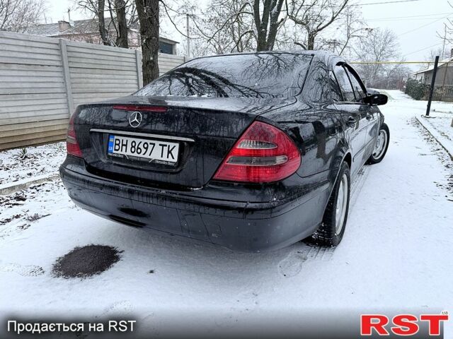 Чорний Мерседес Е-Клас, об'ємом двигуна 2.1 л та пробігом 444 тис. км за 7500 $, фото 1 на Automoto.ua