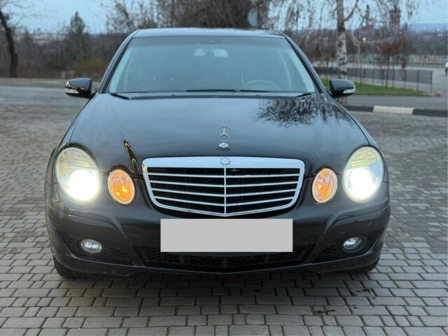Черный Мерседес Е-Класс, объемом двигателя 2 л и пробегом 245 тыс. км за 7500 $, фото 1 на Automoto.ua