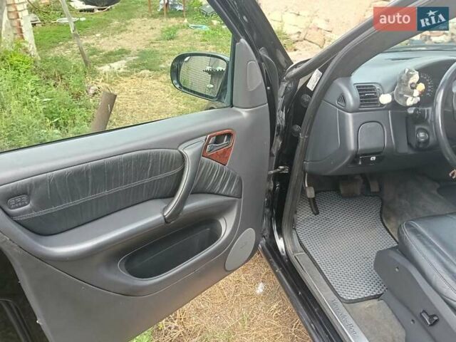 Чорний Мерседес М-Клас, об'ємом двигуна 4 л та пробігом 233 тис. км за 5200 $, фото 5 на Automoto.ua
