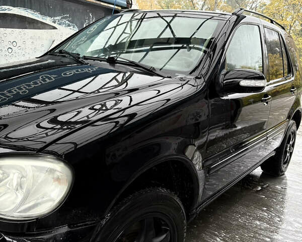 Черный Мерседес М-Класс, объемом двигателя 3.5 л и пробегом 230 тыс. км за 7500 $, фото 12 на Automoto.ua