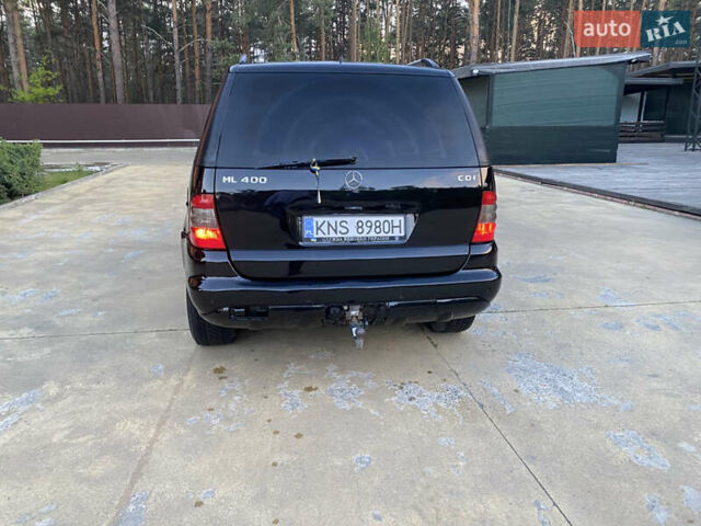 Чорний Мерседес М-Клас, об'ємом двигуна 4 л та пробігом 446 тис. км за 5000 $, фото 4 на Automoto.ua