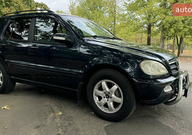 Синий Мерседес М-Класс, объемом двигателя 4 л и пробегом 240 тыс. км за 5150 $, фото 6 на Automoto.ua