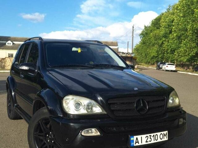 Черный Мерседес МЛ 350, объемом двигателя 3.7 л и пробегом 325 тыс. км за 5555 $, фото 1 на Automoto.ua