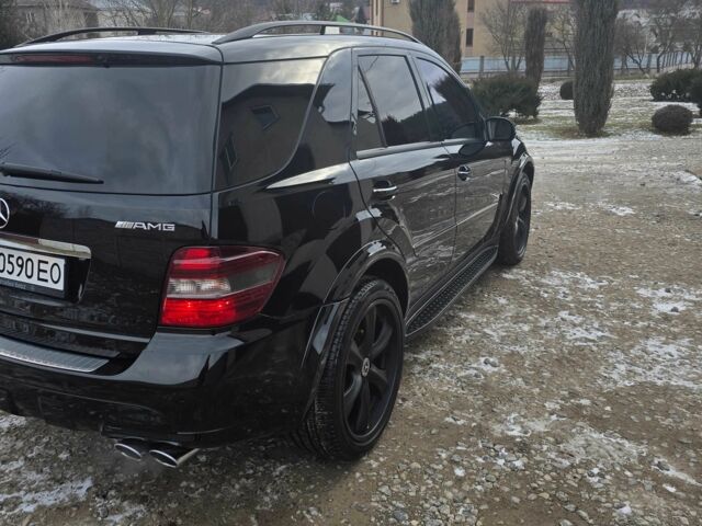 Чорний Мерседес МЛ, об'ємом двигуна 6.2 л та пробігом 218 тис. км за 14500 $, фото 13 на Automoto.ua