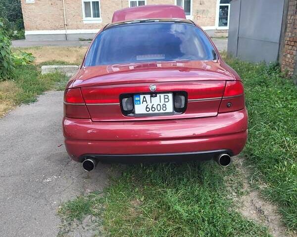 Красный Меркури Мистик, объемом двигателя 2 л и пробегом 239 тыс. км за 2800 $, фото 1 на Automoto.ua