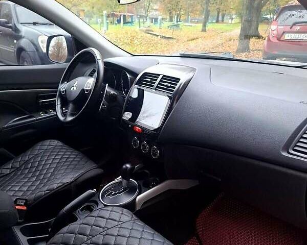 Белый Мицубиси АСХ, объемом двигателя 2 л и пробегом 115 тыс. км за 9800 $, фото 3 на Automoto.ua