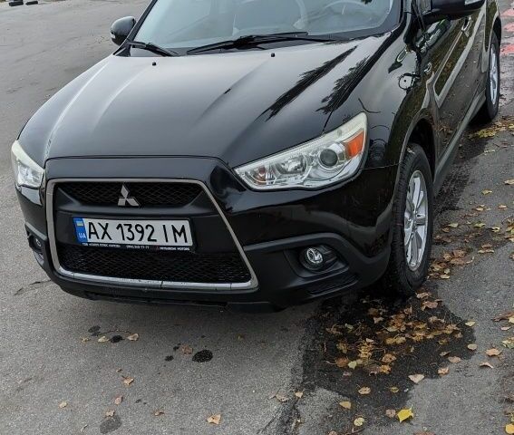 Черный Мицубиси АСХ, объемом двигателя 1.8 л и пробегом 140 тыс. км за 11200 $, фото 1 на Automoto.ua