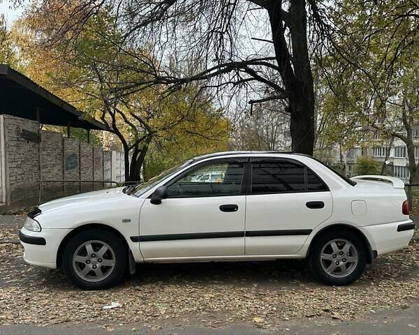 Білий Міцубісі Харизма, об'ємом двигуна 1.6 л та пробігом 356 тис. км за 4000 $, фото 2 на Automoto.ua