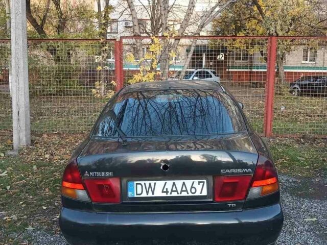 Міцубісі Харизма 1997 у Краматорске на Automoto.ua Чорний Міцубісі Харизма, об'ємом двигуна 0 л та пробігом 100 тис. км за 716 $, фото 5 на Automoto.ua