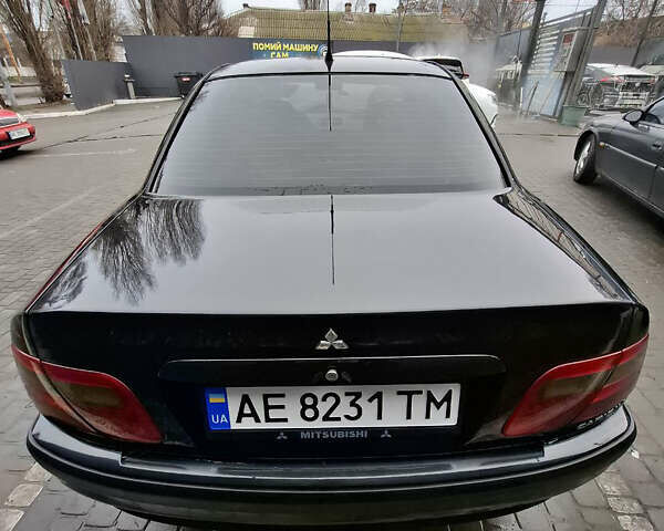 Черный Мицубиси Харизма, объемом двигателя 1.6 л и пробегом 280 тыс. км за 2600 $, фото 12 на Automoto.ua
