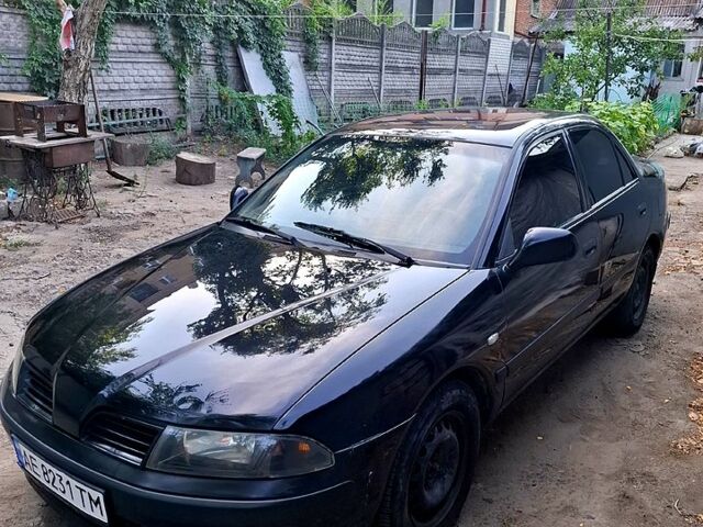 Чорний Міцубісі Харизма, об'ємом двигуна 1.6 л та пробігом 280 тис. км за 2600 $, фото 1 на Automoto.ua