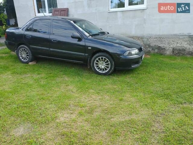 Чорний Міцубісі Харизма, об'ємом двигуна 1.6 л та пробігом 408 тис. км за 2600 $, фото 1 на Automoto.ua