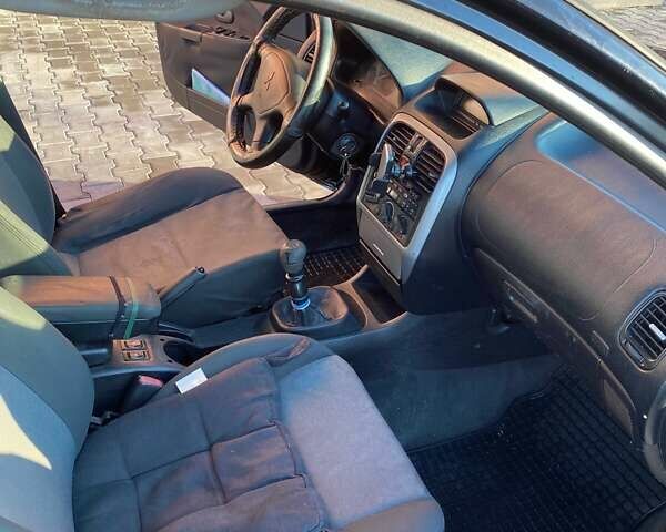 Черный Мицубиси Харизма, объемом двигателя 1.6 л и пробегом 30 тыс. км за 3000 $, фото 6 на Automoto.ua