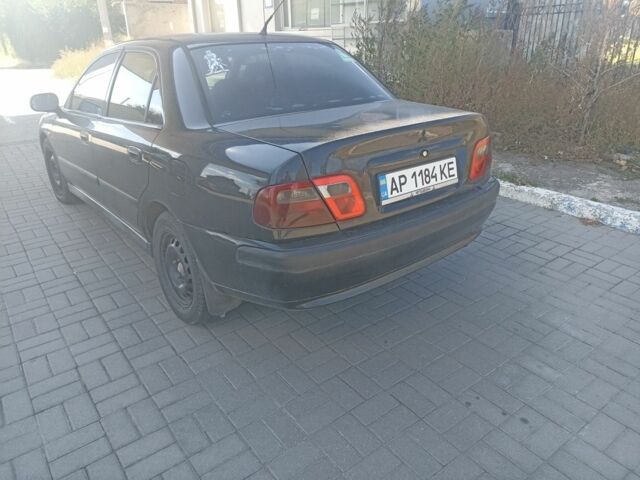 Черный Мицубиси Харизма, объемом двигателя 1.6 л и пробегом 402 тыс. км за 2200 $, фото 3 на Automoto.ua