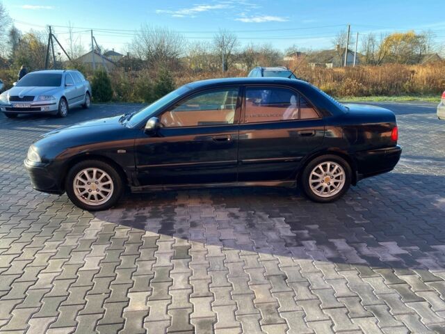 Черный Мицубиси Харизма, объемом двигателя 1.6 л и пробегом 30 тыс. км за 3000 $, фото 3 на Automoto.ua