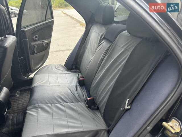 Чорний Міцубісі Харизма, об'ємом двигуна 1.6 л та пробігом 336 тис. км за 3500 $, фото 8 на Automoto.ua