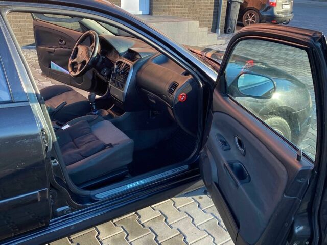 Черный Мицубиси Харизма, объемом двигателя 1.6 л и пробегом 30 тыс. км за 3000 $, фото 8 на Automoto.ua