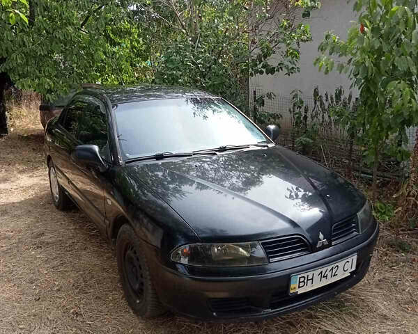 Черный Мицубиси Харизма, объемом двигателя 1.6 л и пробегом 167 тыс. км за 3100 $, фото 2 на Automoto.ua