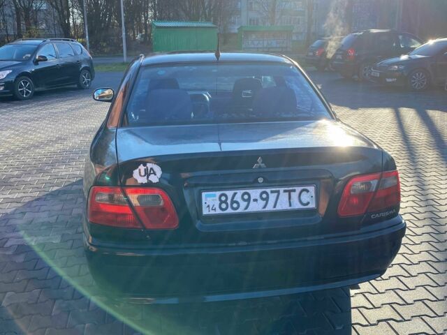 Черный Мицубиси Харизма, объемом двигателя 1.6 л и пробегом 30 тыс. км за 3000 $, фото 2 на Automoto.ua