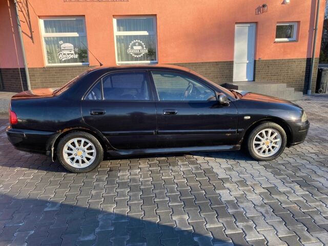 Черный Мицубиси Харизма, объемом двигателя 1.6 л и пробегом 30 тыс. км за 3000 $, фото 1 на Automoto.ua