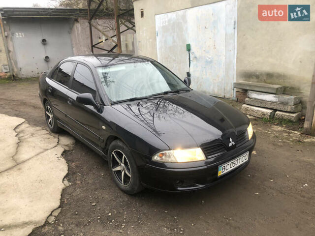 Чорний Міцубісі Харизма, об'ємом двигуна 1.6 л та пробігом 270 тис. км за 4300 $, фото 1 на Automoto.ua