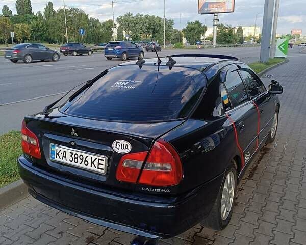 Чорний Міцубісі Харизма, об'ємом двигуна 1.8 л та пробігом 278 тис. км за 4900 $, фото 2 на Automoto.ua