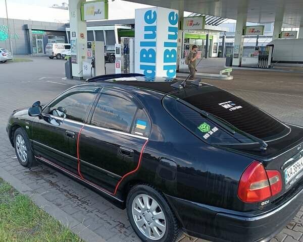 Чорний Міцубісі Харизма, об'ємом двигуна 1.8 л та пробігом 278 тис. км за 4900 $, фото 3 на Automoto.ua