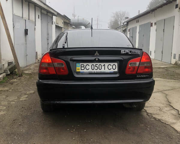 Чорний Міцубісі Харизма, об'ємом двигуна 1.6 л та пробігом 270 тис. км за 4300 $, фото 4 на Automoto.ua