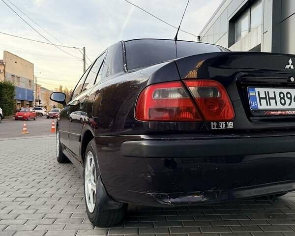 Фиолетовый Мицубиси Харизма, объемом двигателя 1.6 л и пробегом 236 тыс. км за 3000 $, фото 2 на Automoto.ua