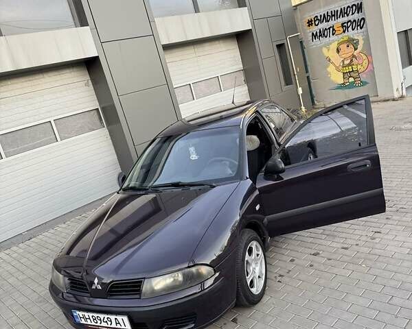Фиолетовый Мицубиси Харизма, объемом двигателя 1.6 л и пробегом 236 тыс. км за 3000 $, фото 5 на Automoto.ua