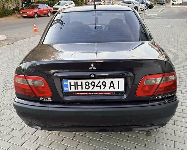 Фиолетовый Мицубиси Харизма, объемом двигателя 1.6 л и пробегом 236 тыс. км за 3000 $, фото 1 на Automoto.ua