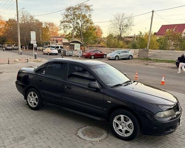 Фиолетовый Мицубиси Харизма, объемом двигателя 1.6 л и пробегом 236 тыс. км за 3000 $, фото 7 на Automoto.ua