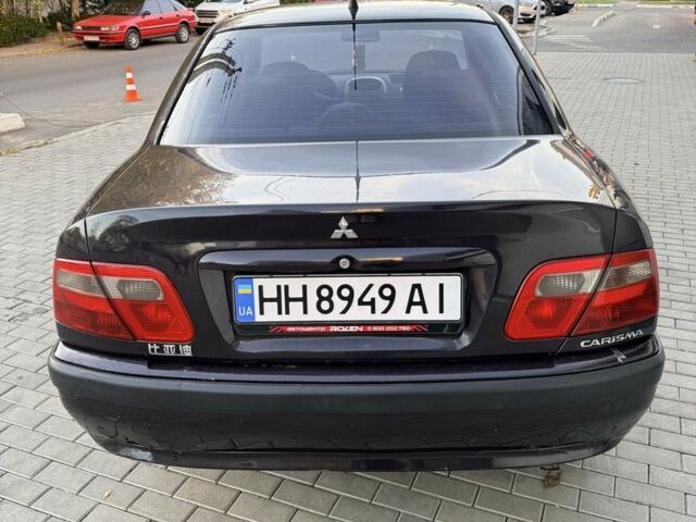 Фіолетовий Міцубісі Харизма, об'ємом двигуна 1.6 л та пробігом 236 тис. км за 3000 $, фото 2 на Automoto.ua