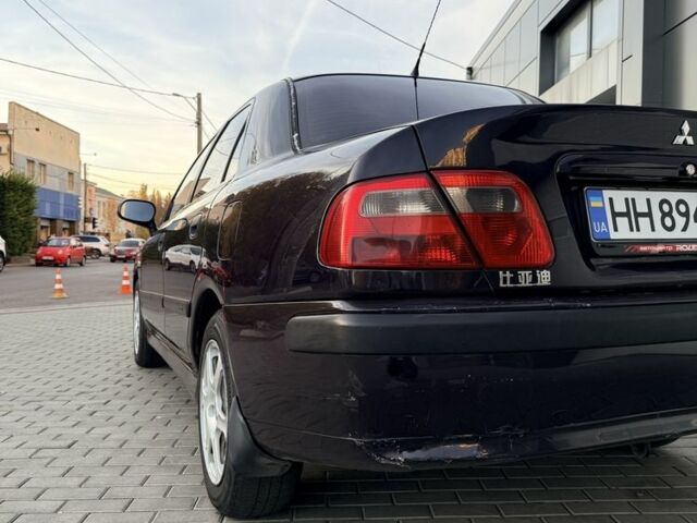 Фіолетовий Міцубісі Харизма, об'ємом двигуна 1.6 л та пробігом 236 тис. км за 3000 $, фото 3 на Automoto.ua