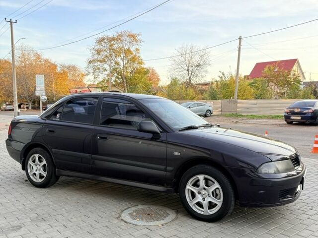 Фіолетовий Міцубісі Харизма, об'ємом двигуна 1.6 л та пробігом 236 тис. км за 3000 $, фото 1 на Automoto.ua