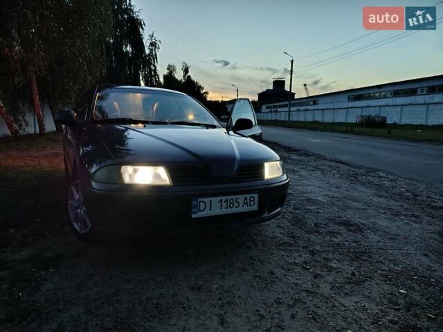 Фиолетовый Мицубиси Харизма, объемом двигателя 1.6 л и пробегом 264 тыс. км за 3600 $, фото 13 на Automoto.ua
