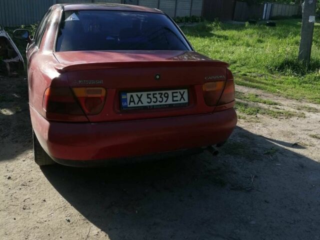 Красный Мицубиси Харизма, объемом двигателя 1.8 л и пробегом 327 тыс. км за 2700 $, фото 6 на Automoto.ua
