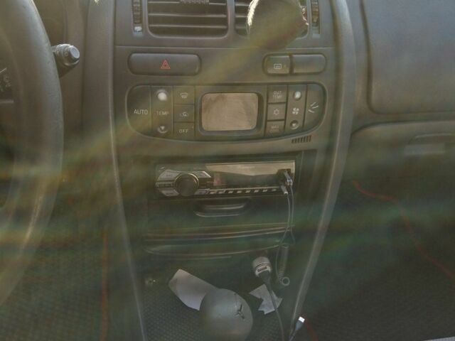 Красный Мицубиси Харизма, объемом двигателя 1.8 л и пробегом 327 тыс. км за 2700 $, фото 8 на Automoto.ua