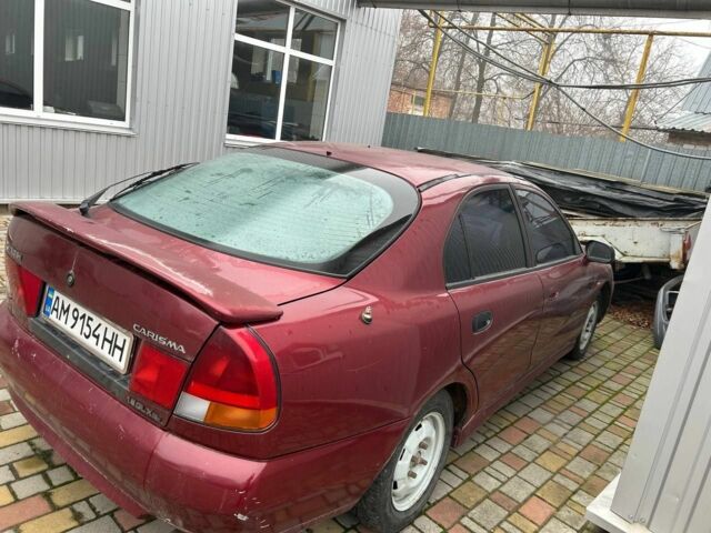 Красный Мицубиси Харизма, объемом двигателя 1.8 л и пробегом 200 тыс. км за 800 $, фото 3 на Automoto.ua