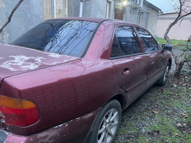 Красный Мицубиси Харизма, объемом двигателя 1.6 л и пробегом 306 тыс. км за 1500 $, фото 3 на Automoto.ua