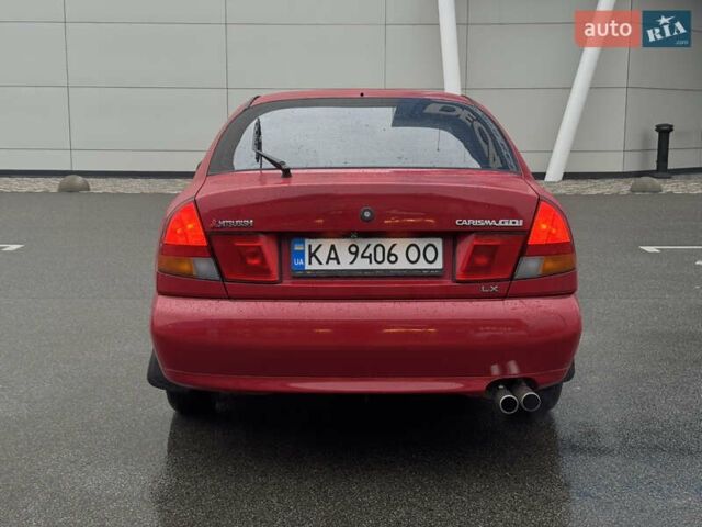 Красный Мицубиси Харизма, объемом двигателя 1.84 л и пробегом 140 тыс. км за 3400 $, фото 3 на Automoto.ua