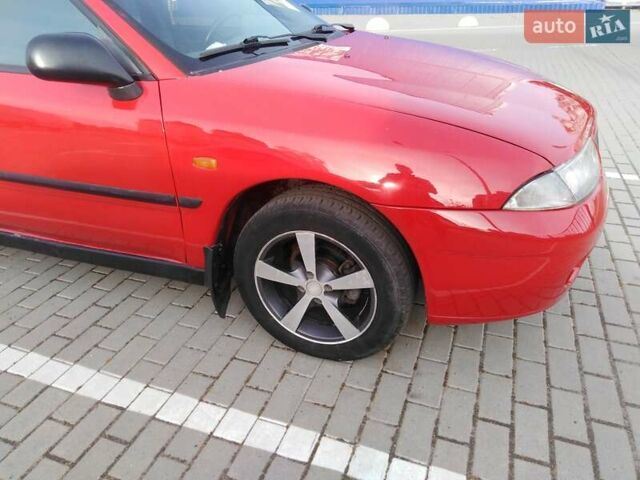 Красный Мицубиси Харизма, объемом двигателя 1.6 л и пробегом 270 тыс. км за 3000 $, фото 18 на Automoto.ua