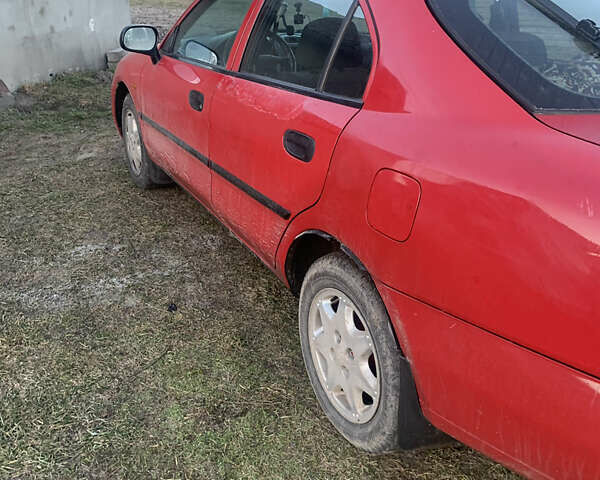 Красный Мицубиси Харизма, объемом двигателя 1.9 л и пробегом 350 тыс. км за 3000 $, фото 5 на Automoto.ua