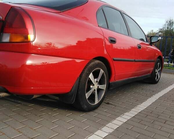 Красный Мицубиси Харизма, объемом двигателя 1.6 л и пробегом 270 тыс. км за 3000 $, фото 19 на Automoto.ua