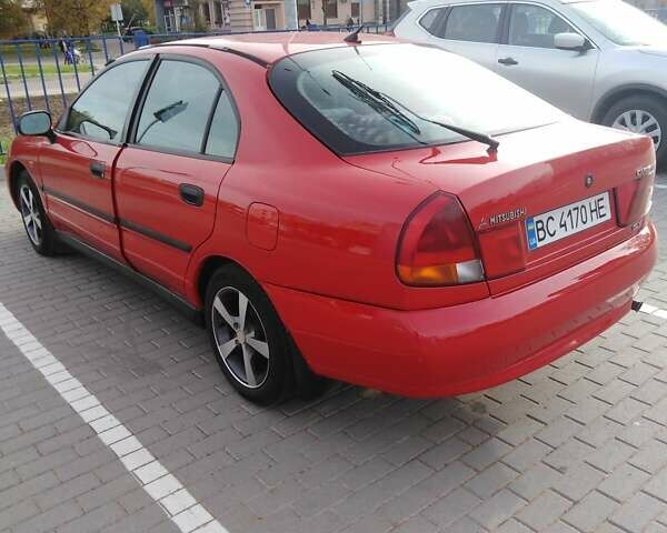 Красный Мицубиси Харизма, объемом двигателя 1.6 л и пробегом 270 тыс. км за 3000 $, фото 10 на Automoto.ua