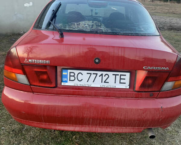 Красный Мицубиси Харизма, объемом двигателя 1.9 л и пробегом 350 тыс. км за 3000 $, фото 2 на Automoto.ua