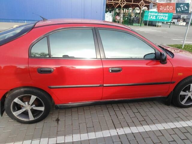 Красный Мицубиси Харизма, объемом двигателя 1.6 л и пробегом 270 тыс. км за 3000 $, фото 9 на Automoto.ua