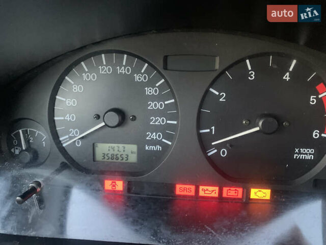Красный Мицубиси Харизма, объемом двигателя 1.9 л и пробегом 350 тыс. км за 3000 $, фото 9 на Automoto.ua