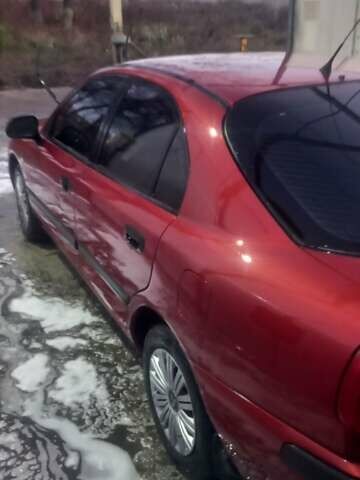 Красный Мицубиси Харизма, объемом двигателя 1.6 л и пробегом 450 тыс. км за 3000 $, фото 7 на Automoto.ua